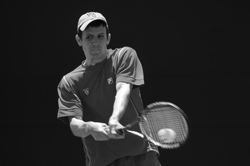 Then junior John Watts hits a backhand against Gustavus Adolphus College in the NCAA quarterfinals last spring. Watts won both of his singles matches at the Wash. U. Fall Invitational over the weekend of Sept. 18-20, but the event was cut short by rain. (Matt Mitgang | Student Life)