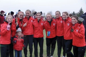 The Washington University Women’s Cross Country team poses for a photo Saturday November 19 after capturing their first NCAA Division III National Title at the Lake Breeze Golf Club in Winneconne, Wisconsin. 