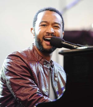 John Legend performs during a climate rally on the National Mall to celebrate Earth Day in Washington, D.C., on Sunday, April 25, 2010. On campus, John Legend will speak about education.