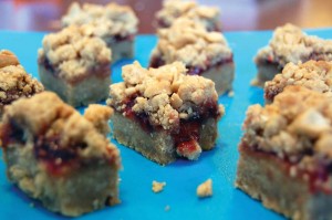 These Peanut Butter and Jelly Bars bring the flavors of a lunchtime classic to a truly decadent treat.