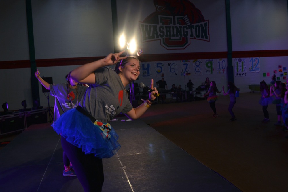 Students hype up the crowd of dancers at Dance Marathon Saturday. DM raises money for Children’s Miracle Network.
