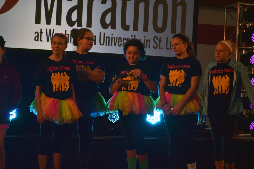 Children stand on stage at the Dance Marathon event in the Athletic Complex Saturday. Dance Marathon celebrated its 19th year at Washington University with this Saturday’s DM party.