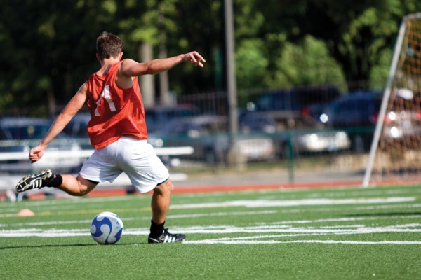 A Washington University men’s soccer player takes a shot at the first practice of the season on August 19. (Kivanc Dundar | Student Life)