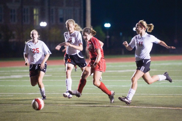 Sophomore Lee Ann Felder, who scored two goals, is chased by three defenders in a 10-0 victory over Grinnell College. (Matt Mitgang | Student Life)