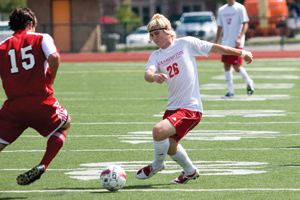 Sophomore Zach Hendrickson attempts to move around a Rhodes College player. The Bears on Sunday recorded a 1-1 double overtime draw, the team’s third tie of the season in just five games. (Paul Goedeke | Student Life)