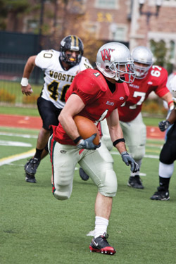 Junior Jim O’Brien runs the ball during last Saturday’s football game vs. the College of Wooster. O’Brien rushed the ball for 105 yards and earned a touchdown, but the Bears couldn’t hold onto the lead losing 20-24. (Daniel Eicholtz | Student Life)