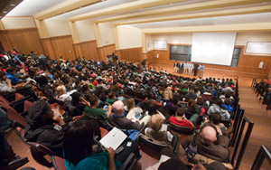 The Mother's Men stand in front of a packed town hall meeting to discuss the next steps following the alleged discrimination incident at Mothers bar in Chicago. Approximately 400 people filled Lab Sciences 300 Monday evening for the town hall event. (Matt Mitgang | Student Life)