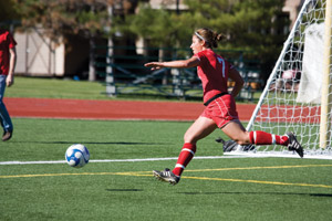 Senior Becca Heymann chases down a loose ball in an Oct. 18 game against the University of Rochester. Heymann scored twice in an 8-0 victory against Fontbonne University on Oct. 25. (Daniel Eicholtz | Student Life)