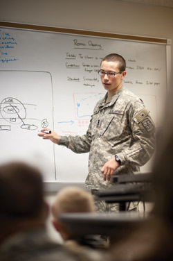 Washington University senior Jared Berkowitz instructs other cadets on how to conduct an ambush. (Matt Mitgang | Student Life)