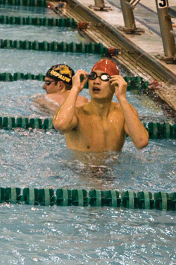 Junior David Chao gazes at the scoreboard after winning the 400 freestyle relay, giving the Bears the overall victory at Saturday’s meet versus Southern Illinois University Carbondale. (Jared Bullock | Student Life)