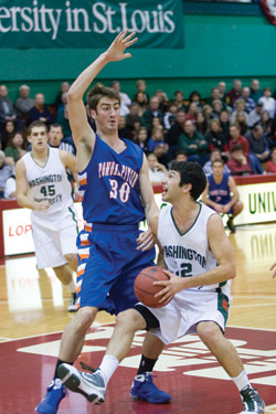 Graduate student Sean Wallis drives into the key in the championship game of the 26th annual Lopata Classic against Pomona-Pitzer College. Wash. U. won 76-50, with Wallis contributing 15 points and eight assists. (Paul Goedeke | Student Life)