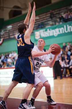 Sophomore Dylan Richter moves around an Augustana College defender on Dec. 12. In Sunday’s away game against Carnegie Mellon University, Richter scored 15 points as the Bears won 81-60. (Matt Mitgang | Student Life)