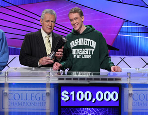 Junior Nick Yozamp receives the Jeopardy! College Championship trophy from host Alex Trebek. Yozamp won $100,000 in the final match, which aired Friday, Feb. 12, 2010. (Courtesy of "Jeopardy!" Productions, Inc.)   