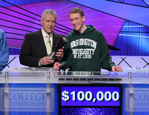 Junior Nick Yozamp receives the Jeopardy! College Championship trophy from host Alex Trebek. Yozamp won $100,000 in the final match, which aired Friday, Feb. 12, 2010. (Courtesy of "Jeopardy!" Productions, Inc.)