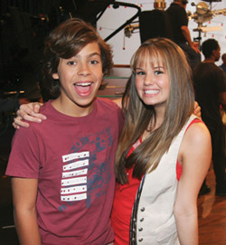 Justin T. Austin and Debby Ryan pose backstage during a filming of “The Suite Life on Deck”. (MCT Campus)