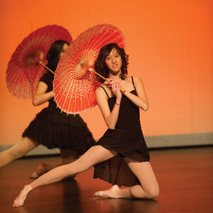 Jessica Yeung performs in the umbrella dance at Lunar New Year Festival 2009.  Culture Shock, a new student group on campus, is attempting to increase attendence at cultural events by people who are not a part of the culture. (Matt Mitgang | Student Life)