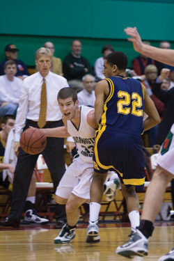 Senior Aaron Thompson dribbles around a Rochester defender. (Cedric Xia | Student Life)