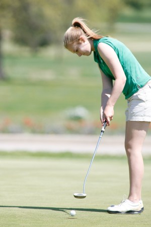 Sophomore Melanie Walsh putts to close out a hole at an earlier match. 