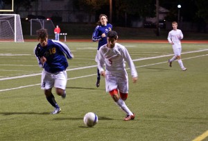 Freshman Nik Patel dribbles the ball up the field on Oct. 21 against Principia College, a game that the Bears won 4-1. Patel and seniors Alex Neumann, Harry Beddo and Randall Schoen anchor a Bear’s defense that has allowed opponents only six goals in 15 games, and the team is currently 11-3-1 on the season and is ranked 15th in the nation.