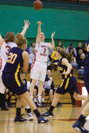 Senior Alex Hoover attempts a three pointer on Sunday against Augustana. Hoover scored 17 points in 25 minutes in the team’s 78-48 victory over the Vikings.