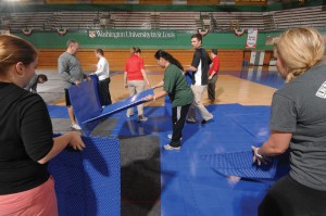 Sportcourt being installed for the NCAA Div. III Volleyball Championships to be held in the WUSTL Fieldhouse.