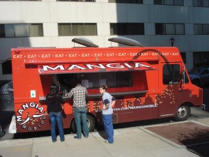 Customers visit Mangia Mobile, an Italian food truck located in the Central West End.