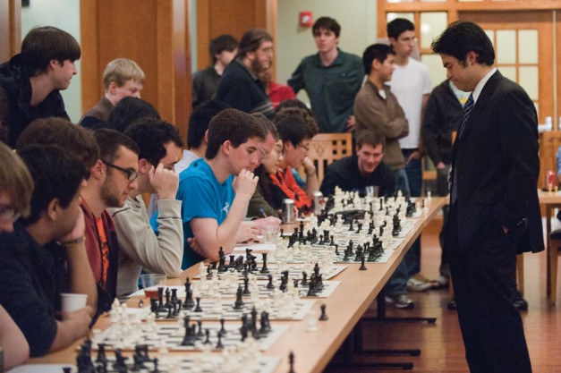 Grandmaster Hikaru Nakamura stops to make his move against junior Mark Rosenberg during the 42-player simul challenge on Saturday. Nakamura defeated all 42 players in around two and a half hours. He also faced challengers in fast-paced bullet chess.