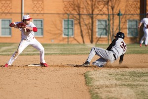 Senior second baseman Travis May turns a double play against Greenville College on Tuesday. May recorded five put-outs in the team’s 8-3 win over the Panthers.
