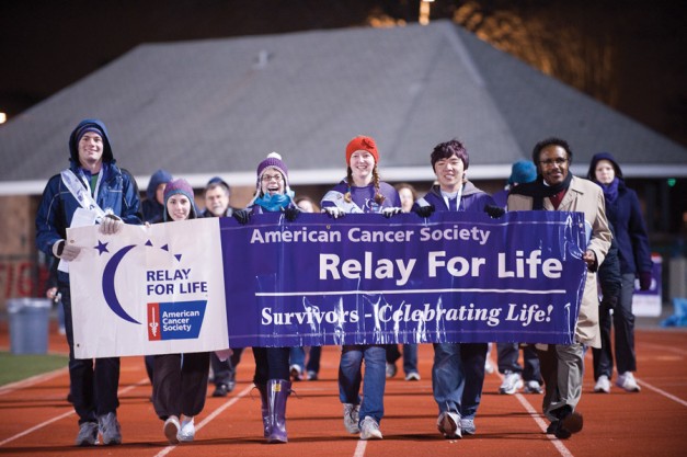 Cancer survivors (L-R) Kyle Newton, Briana Keightley,  Jordan Wagner, Annie Wallentine, Eric Teng and Dean James McLeod lead the survivors’ and caregivers’ lap to start off the 2011 Relay for Life on Saturday night. This year’s Relay raised more than a quarter million dollars for the American Cancer Society.