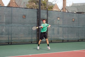 Senior Isaac Stein unleashes on a forehand against Graceland University on March 12. Stein, the top-ranked player for the Bears, went 3-2 in doubles and 1-4 in singles in the Bears’ five matches against top-20 opponents this month.
