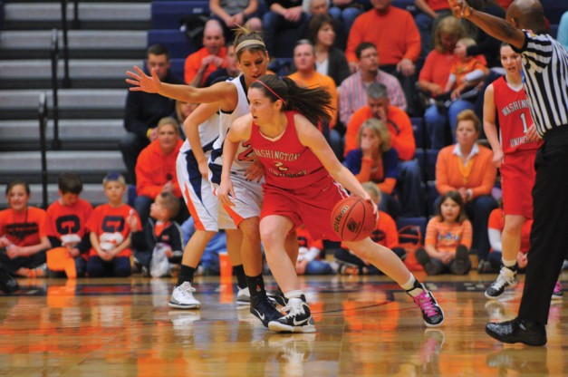 Senior Alex Hoover looks to pass while dribbling around a Hope College defender on Saturday. Hoover scored a team-high 16 points in the No. 12 Bears 56-52 victory over the No. 4 Flying Dutch in the second round of the 2011 Division III NCAA women’s basketball tournament.