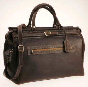 Antique brass buckles and durable stitching mean this man-bag is ready for the road.