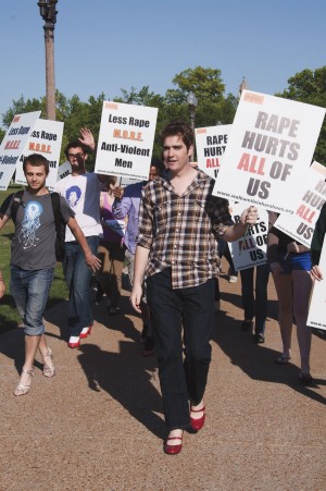Male protestors don high heels to bring awareness to sexual assault and violence on campus. 