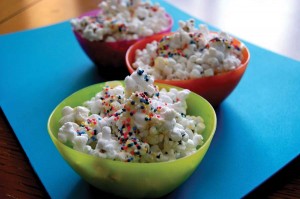 This Party Popcorn makes a visual statement with a generous helping of of rainbow sprinkles. 