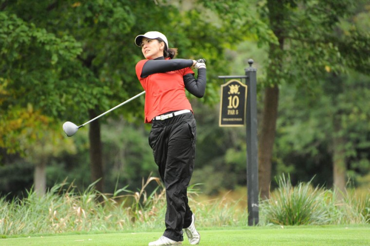 Senior Olivia Lugar watches her tee shot at the O’Brien National Invitational in South Bend, Ind., on Sept. 15, 2013. Last season, Lugar won three tournaments and had a stroke average of 77.60, ranking 10th in Division III.
