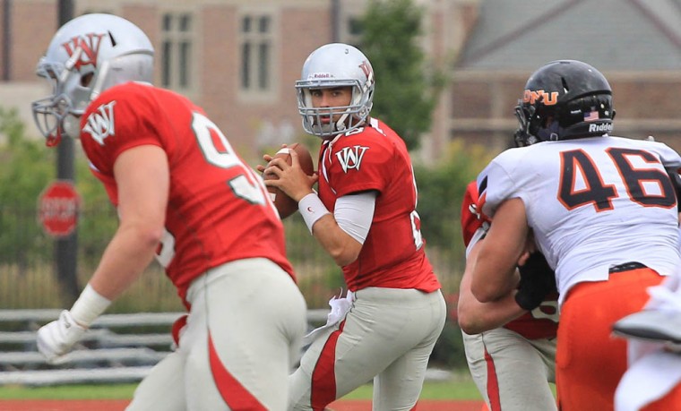 Sophomore quarterback J.J. Tomlin drops back in the pocket and surveys the field against Ohio Northern University on Sept. 9. Tomlin completed 24 of 47 passes for 250 yards and threw two touchdowns in a 46-22 loss to Rhodes College on Saturday.