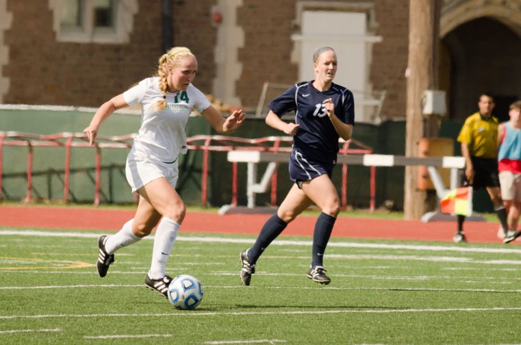 Junior forward Olivia Lillegraven dribbles the ball in the Bears' game against Wheaton College on Sept. 27. The Red and Green tied 1-1 in their game this weekend against Emory University.