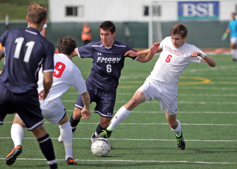 Junior midfielder Jack West fights for the ball in the Bears’ game against Emory University on Sunday. Although West scored in the second half, the Bears fell in overtime 2-1.
