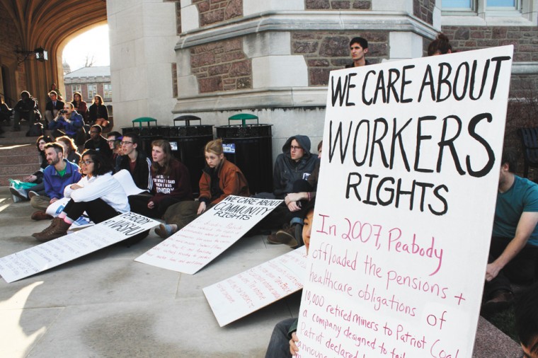 Protesters listen to a speaker outside Brookings Hall as part of a sit-in against Peabody Energy in April. Students staged the sit-in for 16 days to protest Peabody's involvement with Washington University, including CEO Greg Boyce being on the University's board of trustees.
