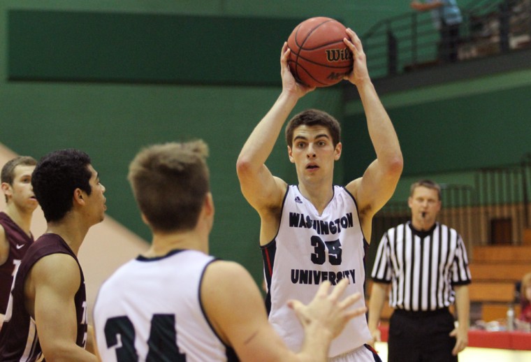 Senior Forward Matt Palucki passes the ball against Trinity. Palucki led the team with 28 points and made 12 out of 13 free-throw attempts.