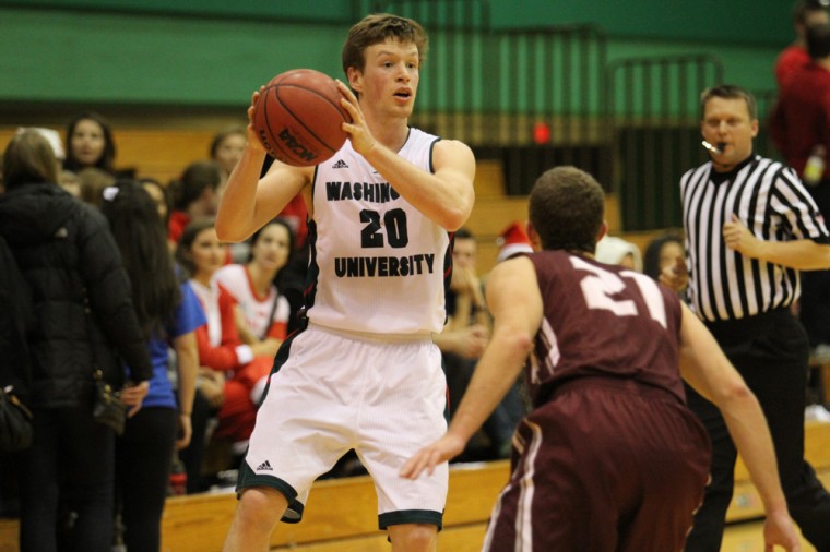 Junior guard Luke Silverman-Lloyd prepares to make a pass against Trinity University on Dec. 6, 2014. Silverman-Lloyd scored a career-high 20 points and made six three-pointers against Brandeis University in a 79-68 win as the Bears salvaged a split of this past weekend’s conference road games. 