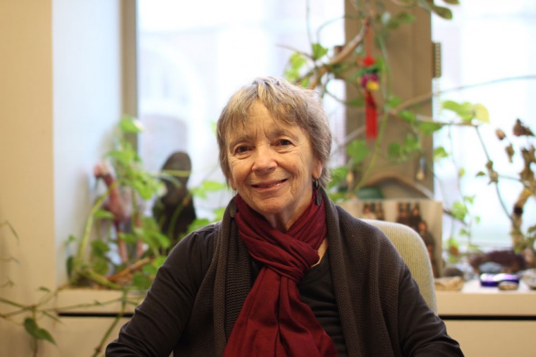 Professor Ursula Goodenough, a member of the Biology department, sits in her office. She has recently contributed to the Big History Project, a free, online-based initiative funded by Bill Gates.