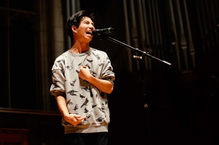 Senior Sam Lai performs in Graham Chapel as part of this year’s Grand Slam event. The slam poetry contest featured 11 artists who recited their poetry on Saturday night.