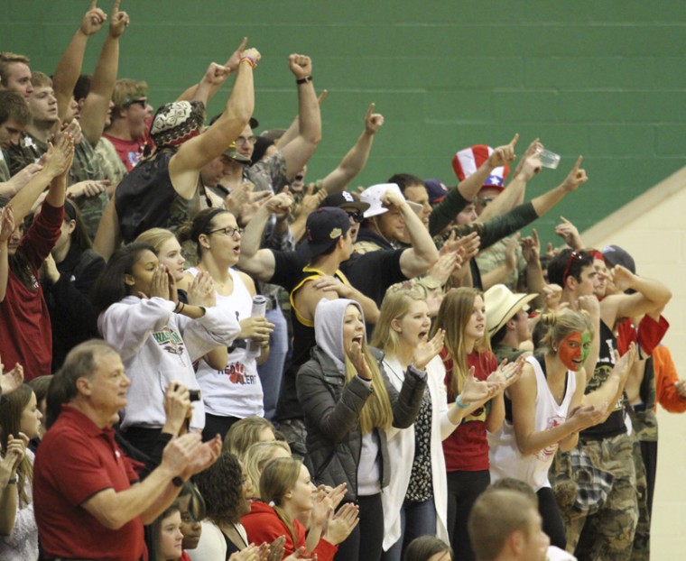 The student section at the Washington University volleyball team’s NCAA third-round contest against Emory University cheers after a Bears point. The game had 582 spectators, many of them students, around 400 more than the average home volleyball game from the 2014 season.