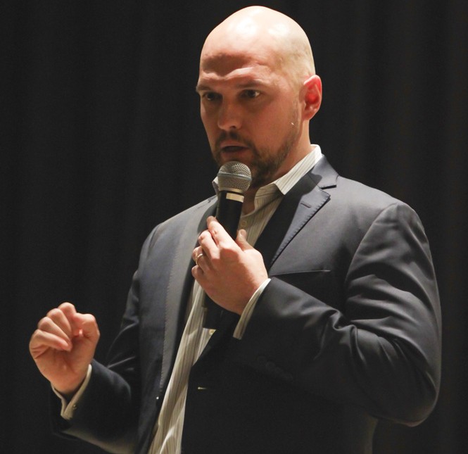 Eric Maddox, an interrogator who helped with the capture Saddam Hussein, speaks in Emerson Auditorium on Thursday. Maddox said he has interrogated more than 2,700 prisoners in his time with the military.