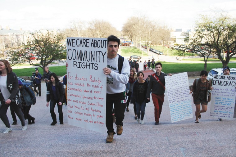 Students march up Brookings Steps last April to initiate a sit-in encouraging Washington University to cut ties with Peabody Energy. The series of protest events concluded with the arrests of seven students trying to deliver a letter encouraging Peabody CEO Greg Boyce to resign from the University’s board of trustees.