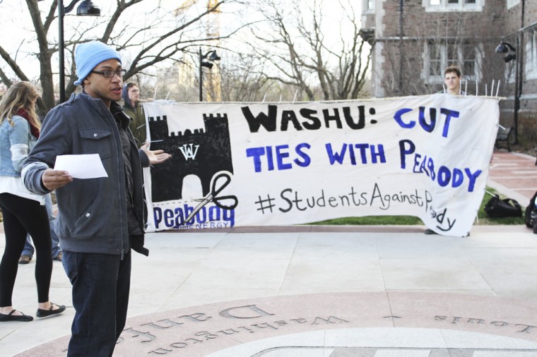 A student informs other rally attendees about Peabody Energy’s Rocky Branch mine using local lands to expand its facilities in Illinois. Students staged a sit-in for more than two weeks last April to protest the University’s involvement with Peabody.