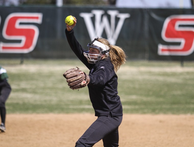 Then-sophomore starting pitcher Annie Pitkin winds up for a pitch on March 23, 2014 against Coe College. Pitkin recorded five strikeouts but allowed four earned runs in a complete-game loss against DePauw University on Saturday.