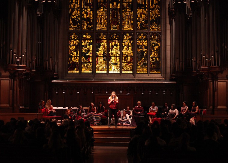 Student performers sit on stage at Graham Chapel for “The Vagina Monologues.” The event, which addressed issues relating to female sexuality from a variety of perspectives, raised money for the St. Louis YWCA and drew about 1,000 attendees across its three-night run over the weekend.