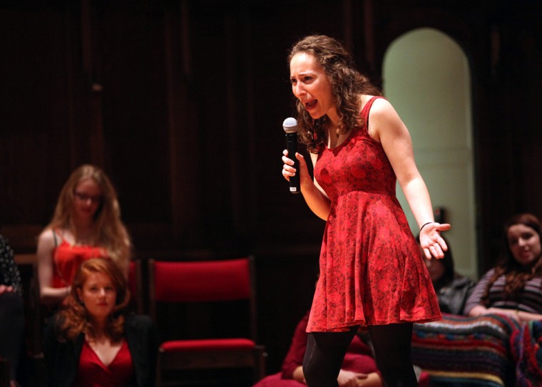 Senior Rachel Hirsch delivers her monologue, “Hair,” as part of “The Vagina Monologues” over the weekend. Female students from all grade levels recited monologues, injecting individual quirks into each performance and frequently drawing laughter and applause from the audience.